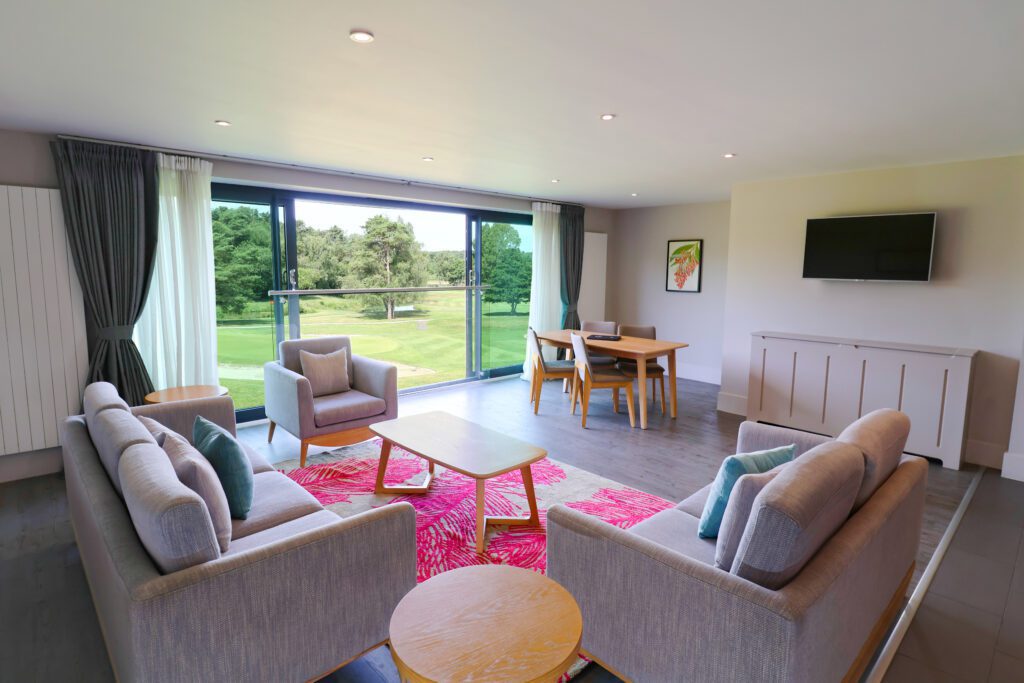 Lounge and living space in 2 bedroom apartment with view of golf course