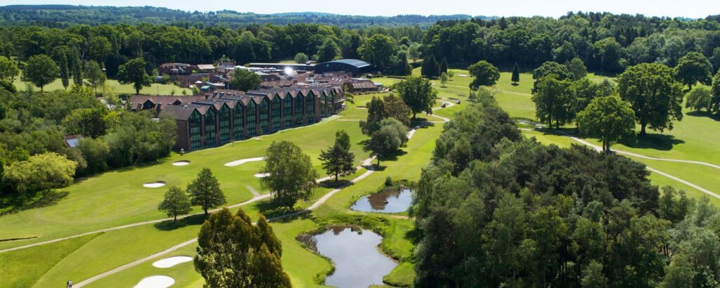 Drone shot of Old Thorns Apartments located on the 9th & 10th tee of the Golf Course