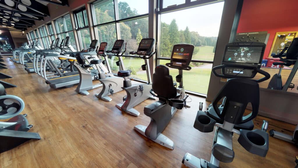 Indoor gym with modern exercise bikes and cardio machines at Old Thorns.