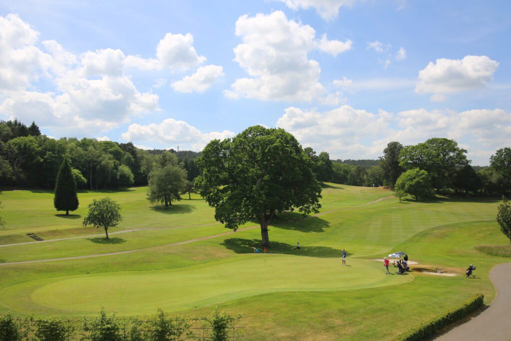 View of Golfers playing Golf at Old Thorns Hotel & Resort