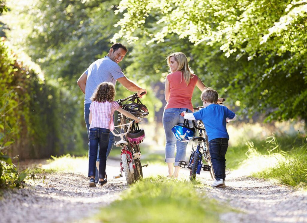 Family enjoying a bike ride activity together