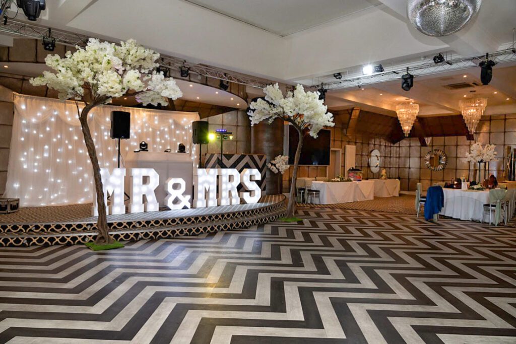 Blossom trees decorating the Gatsby Ballroom dance floor for a wedding