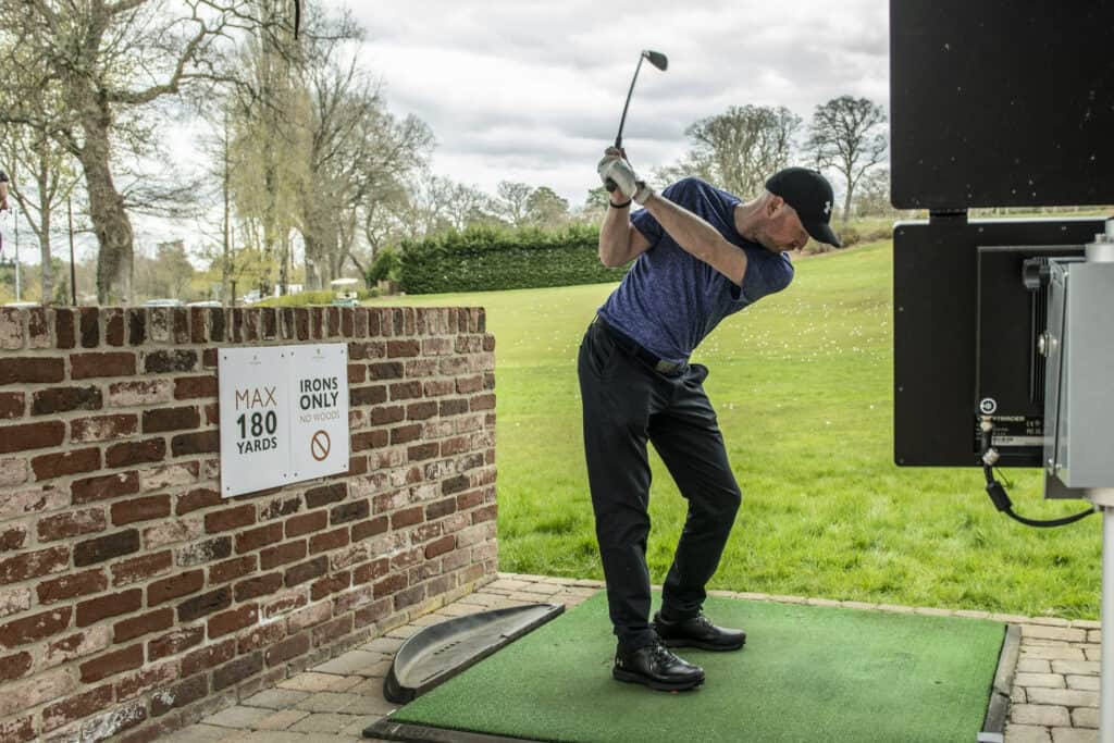 Photo of a man playing TopTracer Driving Range at Old Thorns Hotel & Resort