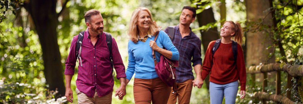 Group enjoying a woodland walk in the sunshine by Old Thorns Hotel & Resort.