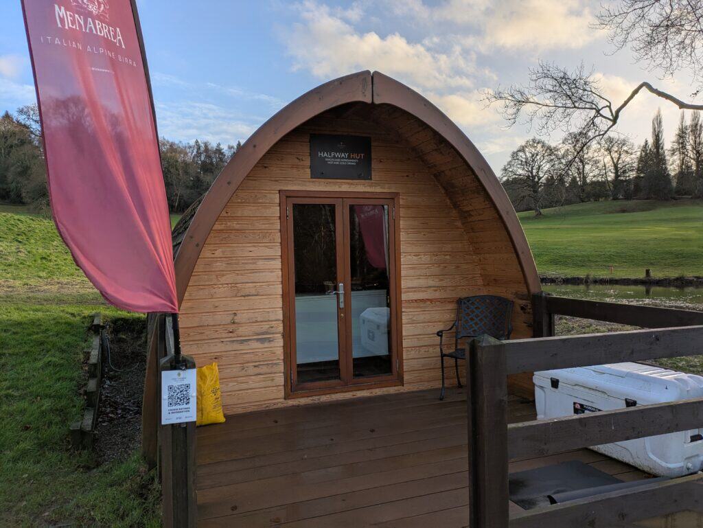Charming wooden Halfway Hut with cozy interior at Old Thorns Golf Resort, perfect for golfers and vi.