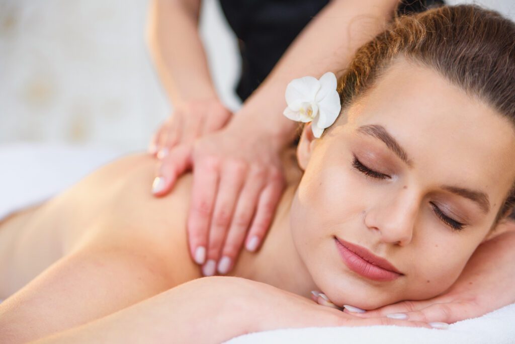 First bloom spa package image of guest having shoulder massage