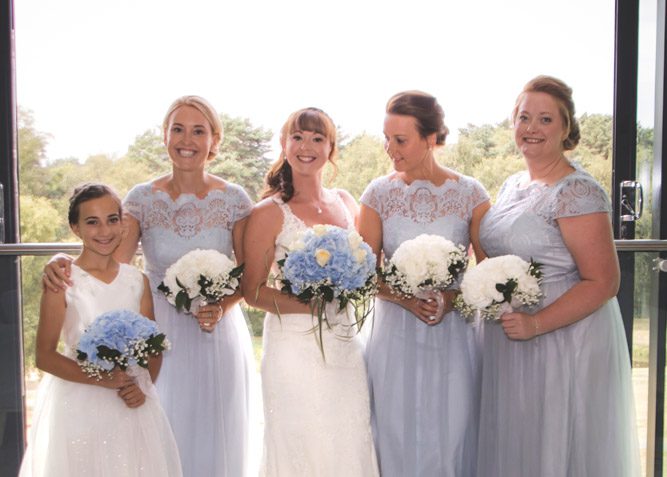 Photo of a bride with her bridesmaids and flower girl in an Apartment at Old Thorns Hotel & Resort.
