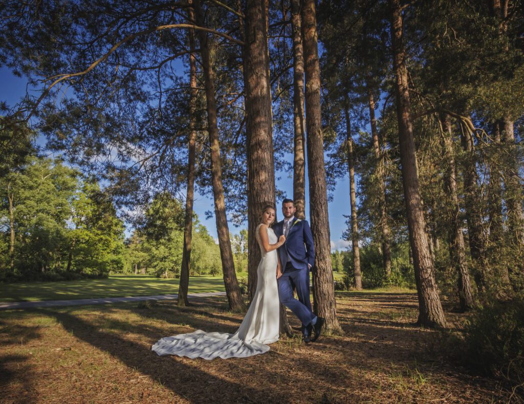 Wedding couple having their photo taken on Old Thorns Golf Course