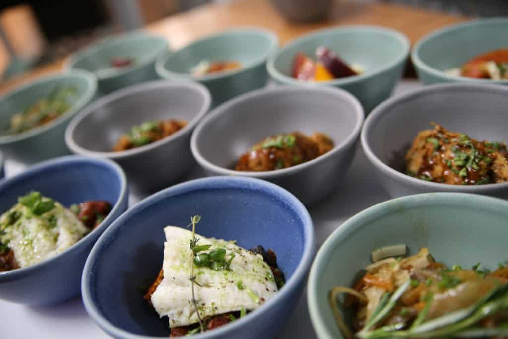 Assorted gourmet tasting plates served in colourful bowls at Old Thorns.