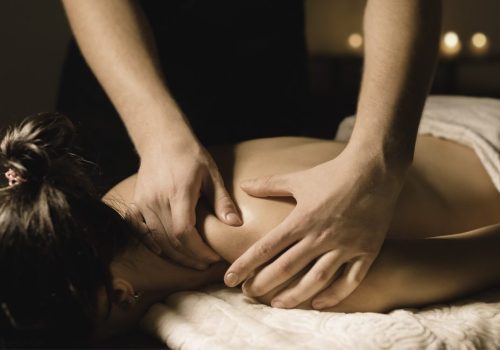 A guest receiving a shoulder massage from a member of the Old Thorns spa team