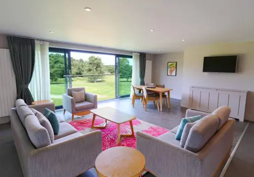 Lounge and living space in 2 bedroom apartment with view of golf course